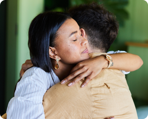 Couple hugging.